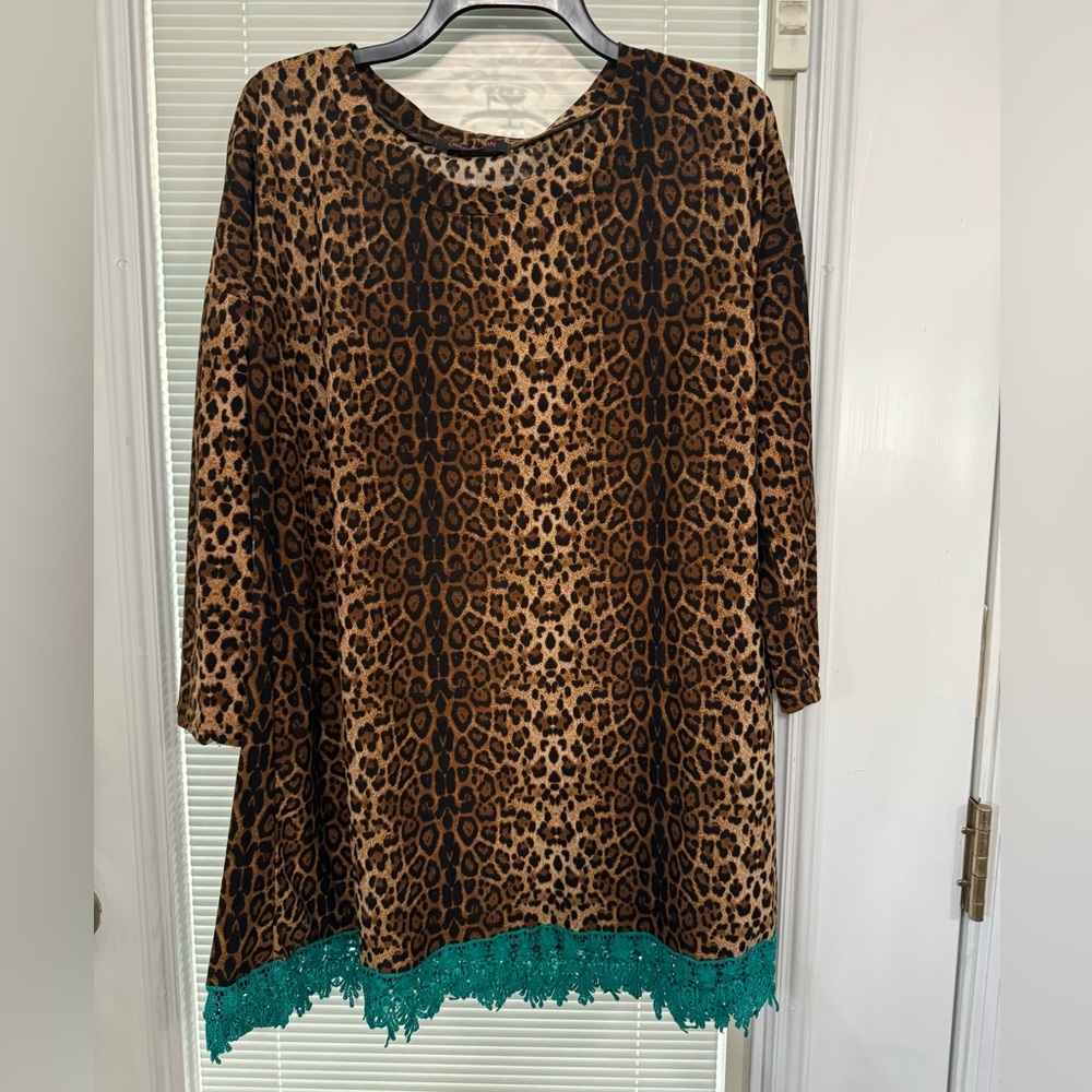 Leopard print tunic, with teal lace trim.
